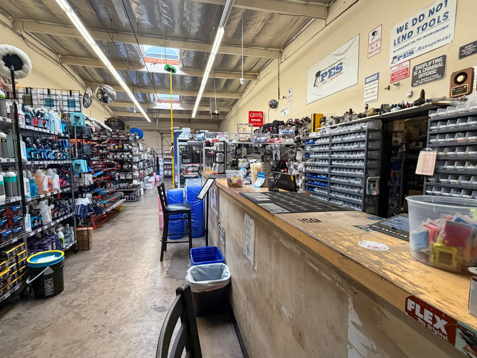 Parts counter and supply aisles inside Pressure Equipment Sales in Glendale